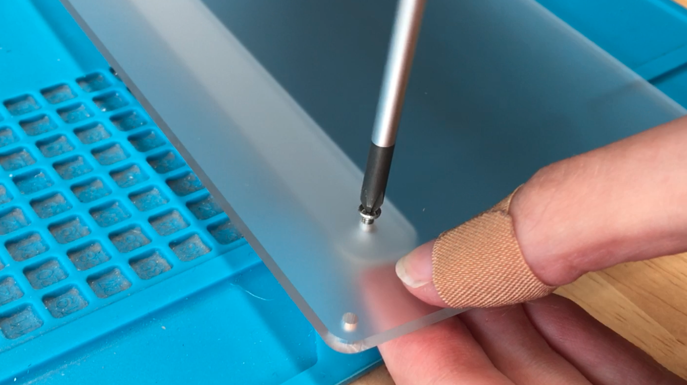 Screwing foot into bottom plate