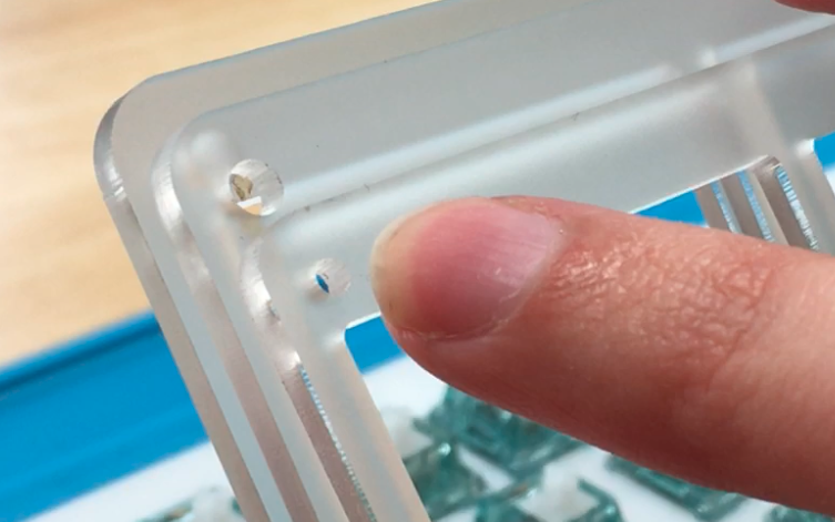 Smallest hole identifying the top acrylic piece