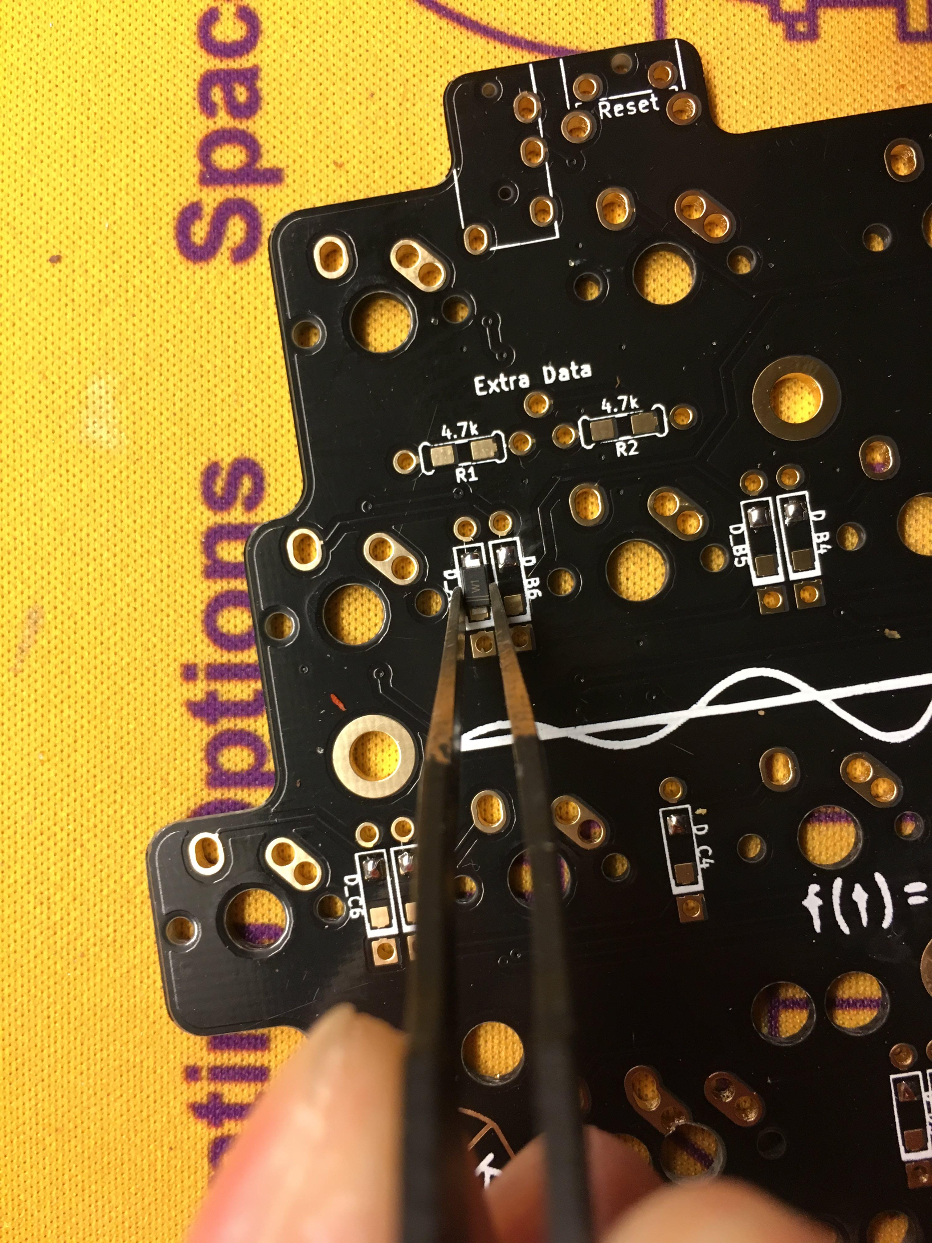 Tweezers Placing SMD Diode on PCB