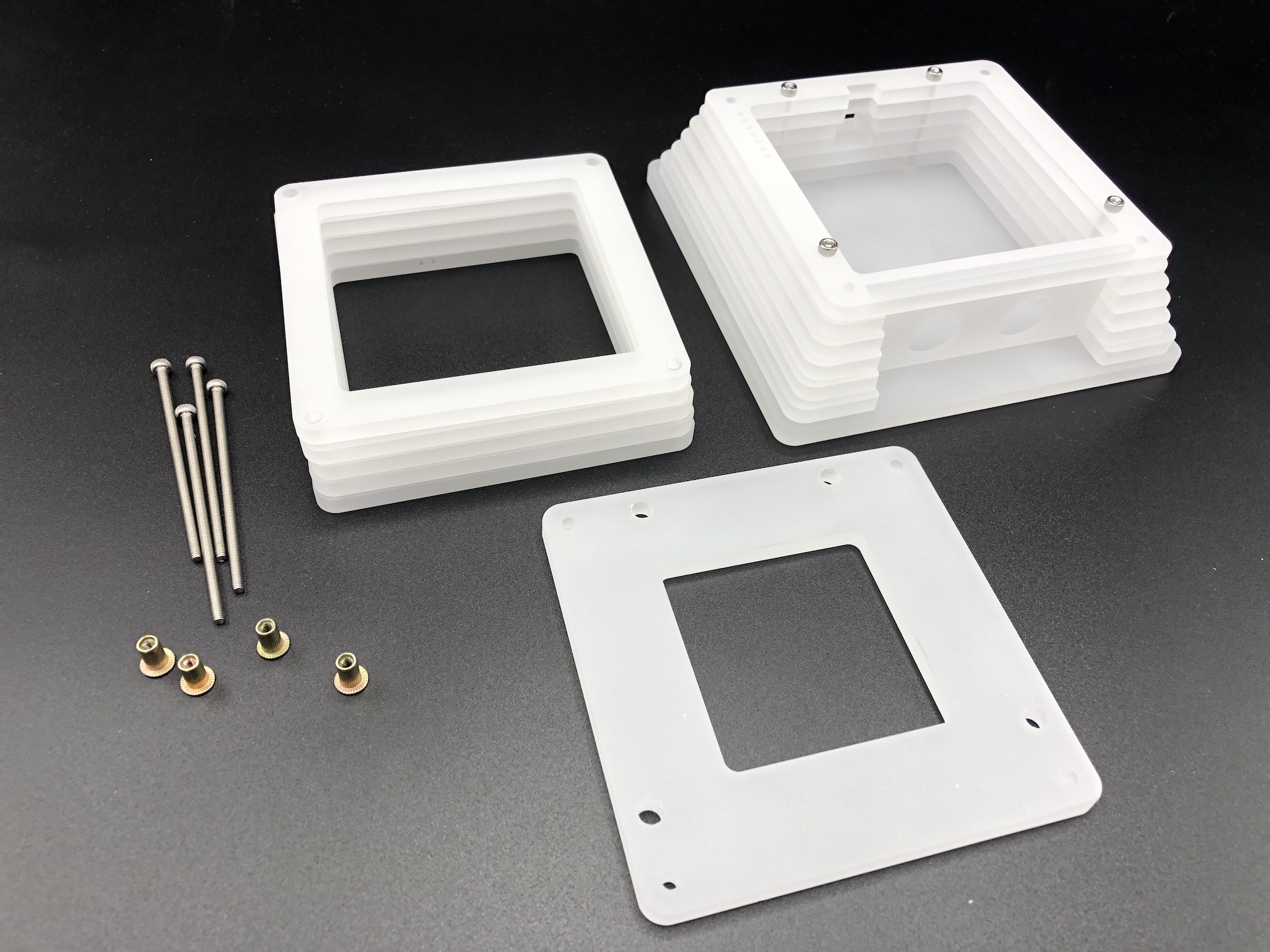 Top case layers and switch plate disassembled