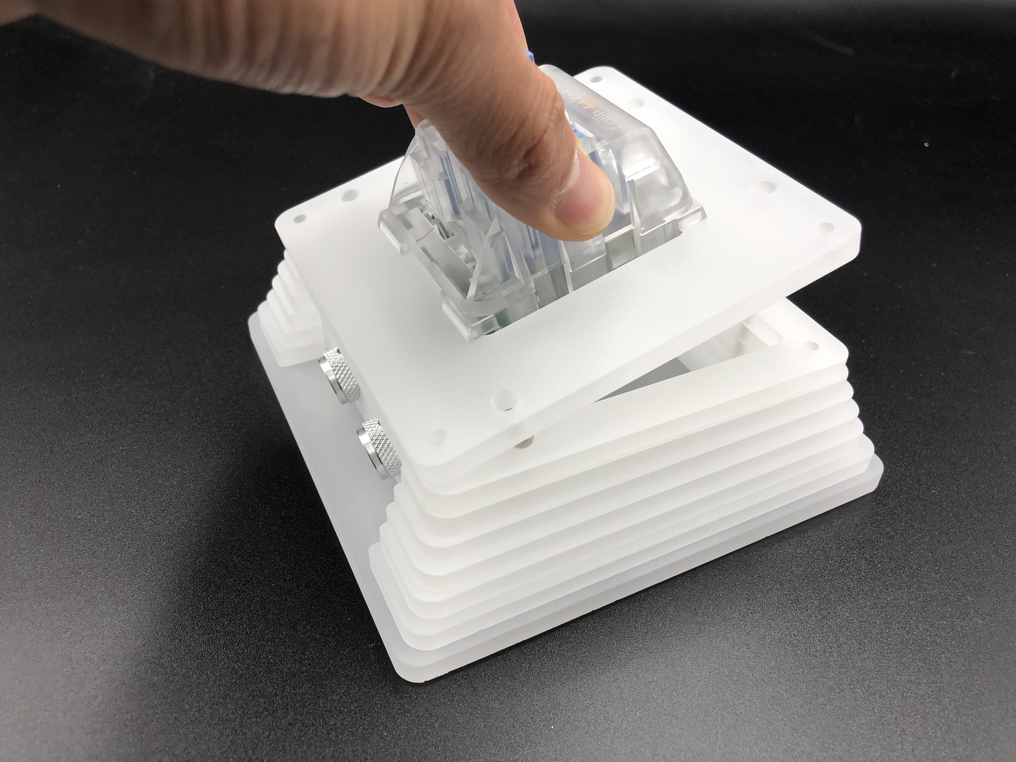 Plate angled into case with knobs first