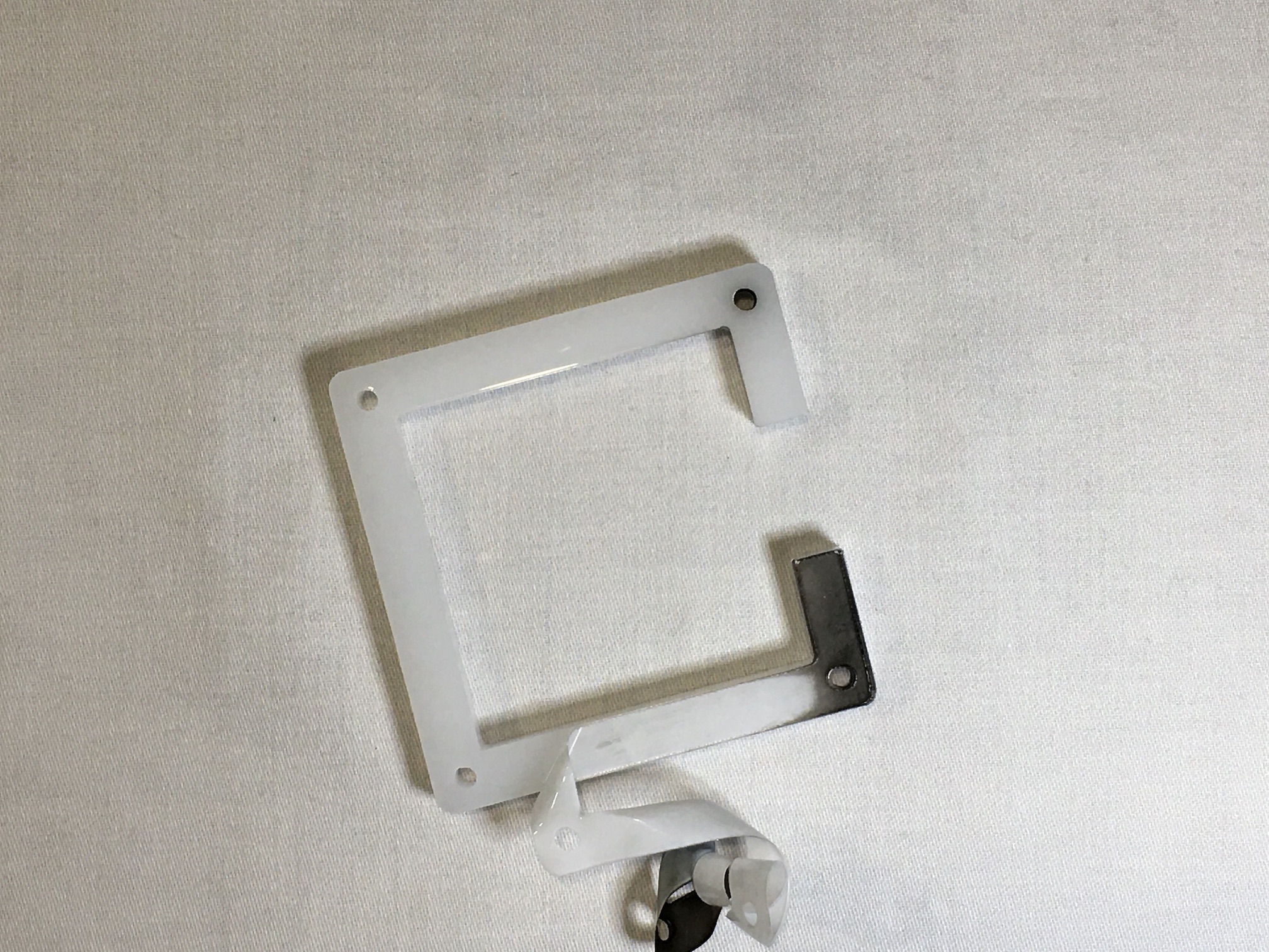 Acrylic plate with backing being peeled