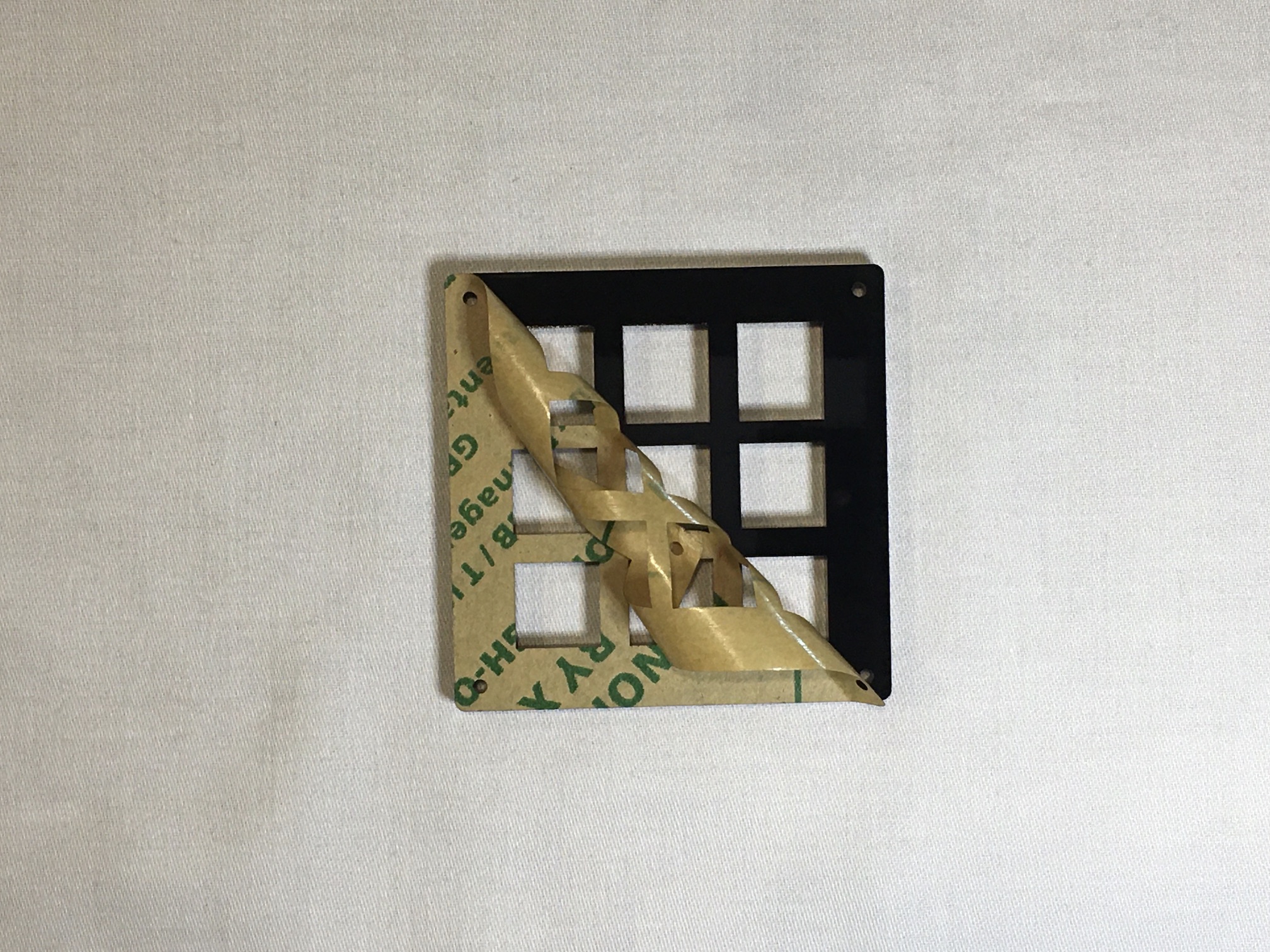 FR4 switch plate with backing being peeled