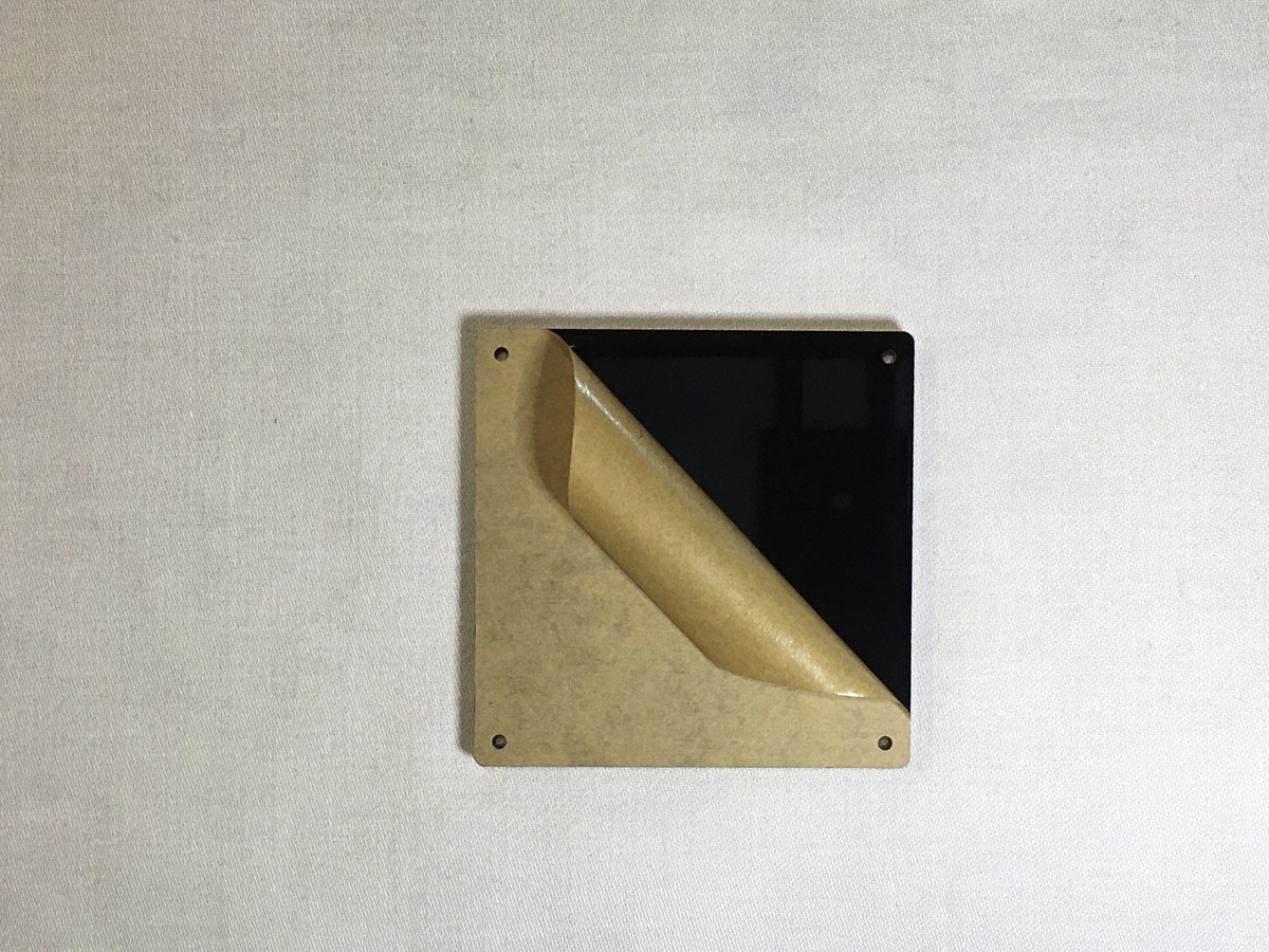 Bottom plate with backing being peeled