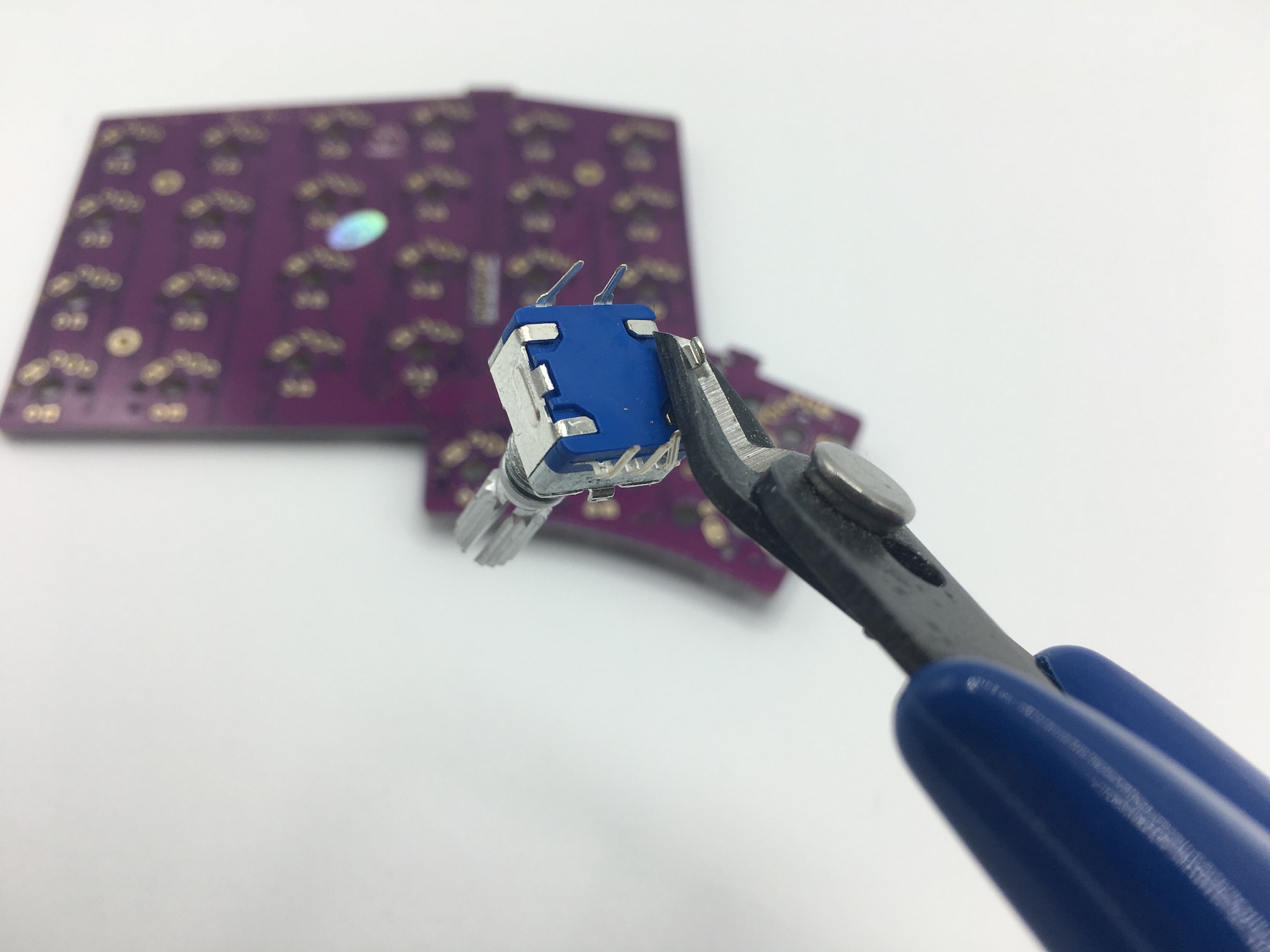 Clipping encoder mounting pins with flush cutters