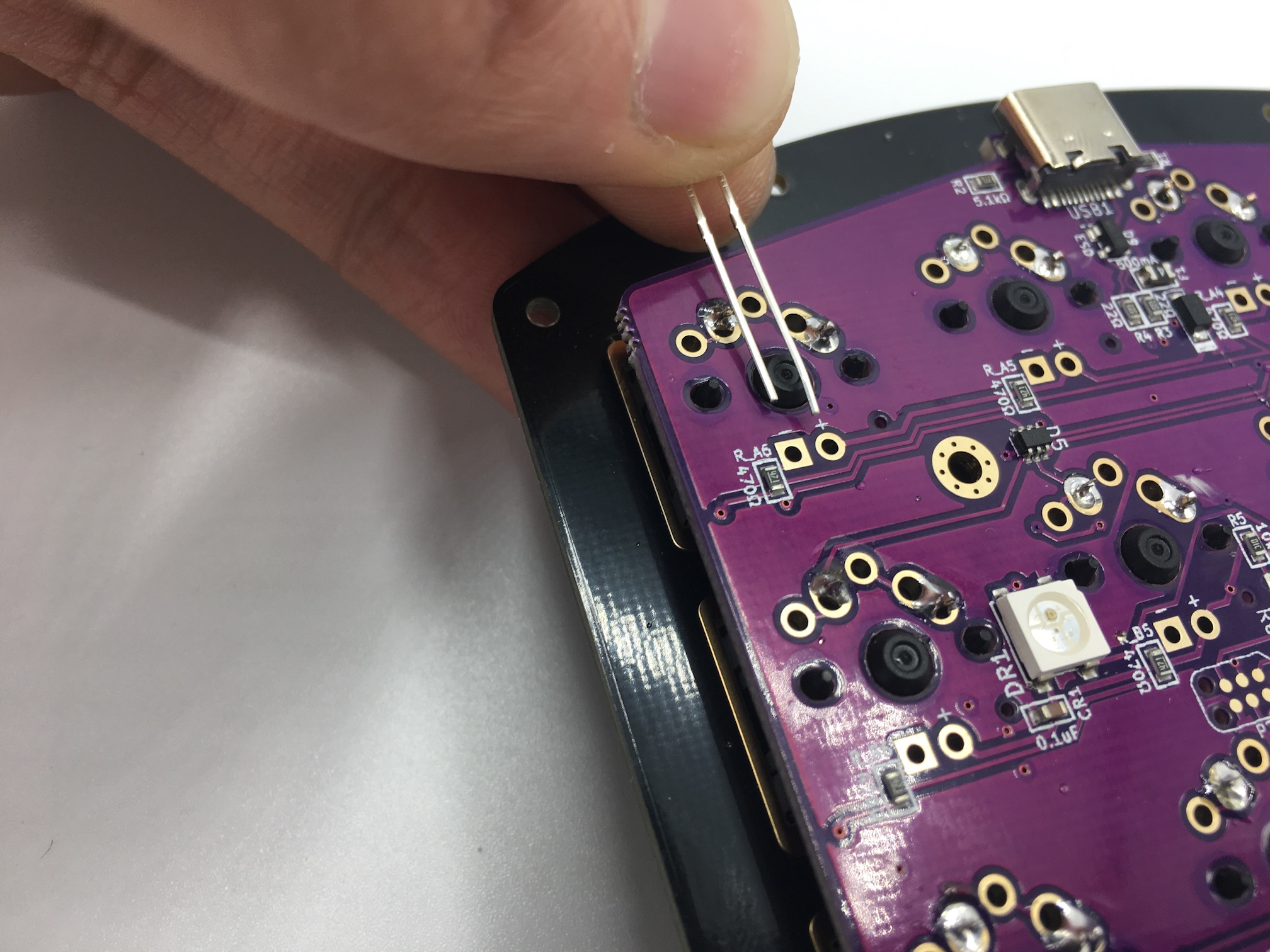 LED legs inserted into PCB + pad