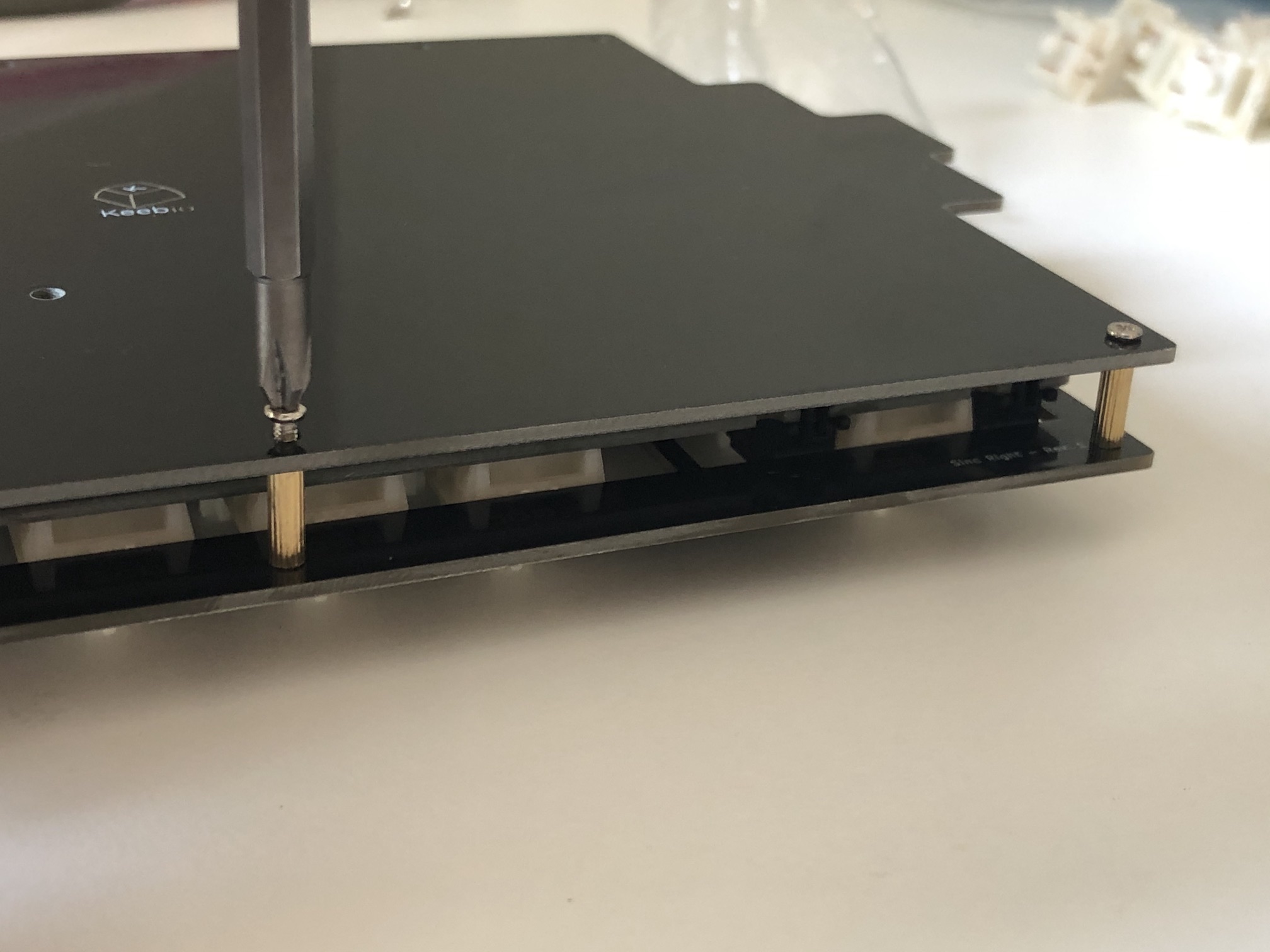 Screwing bottom plate to standoffs