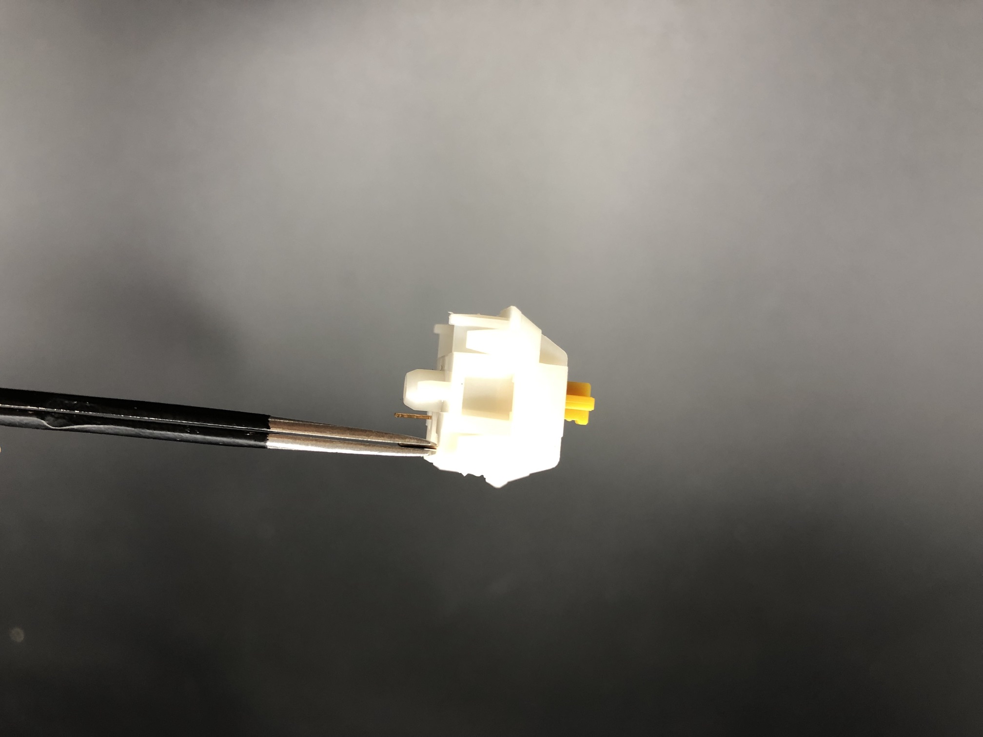 Straightening a bent switch pin with tweezers