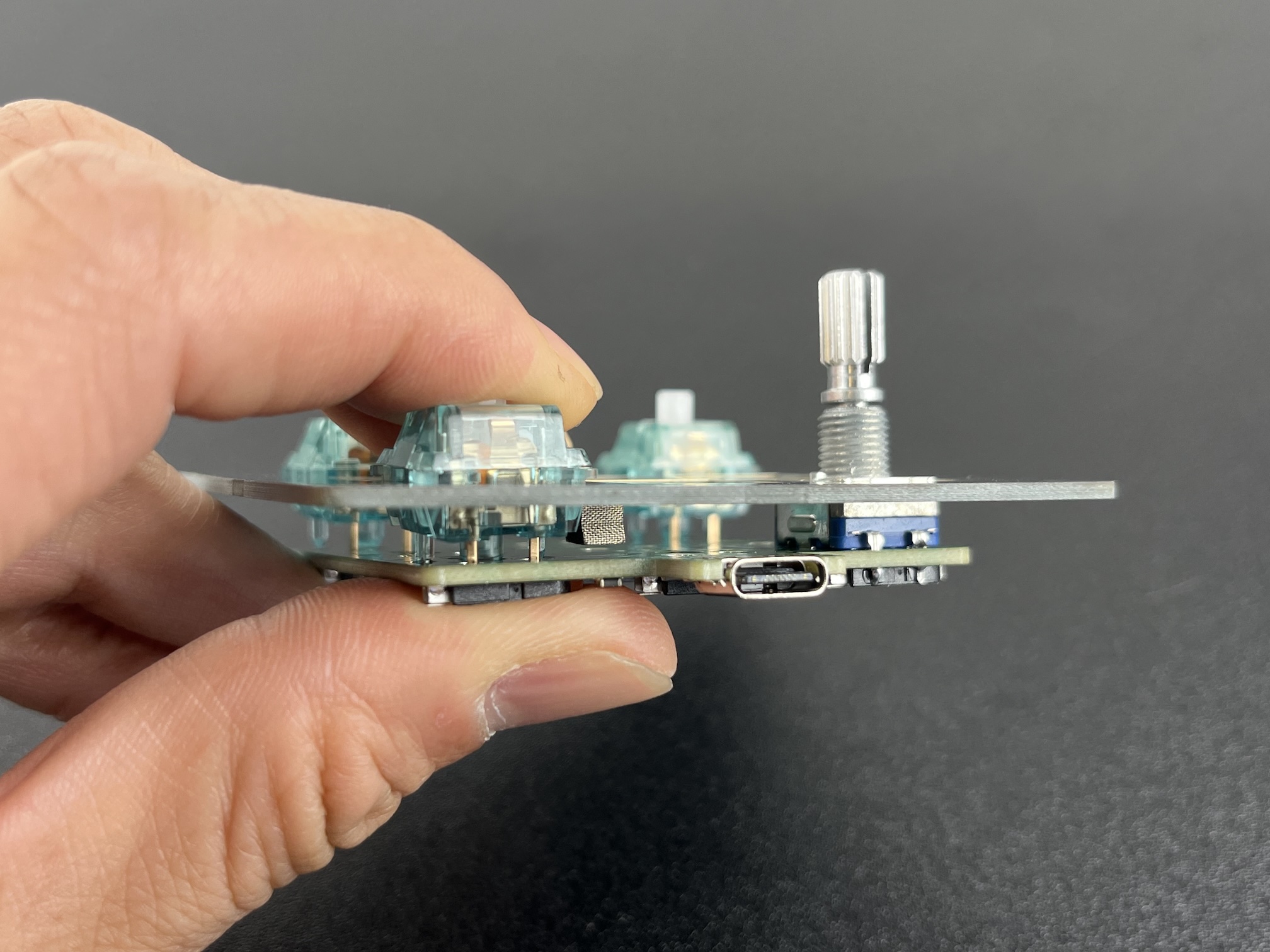 Hand pressing switch into hotswap socket