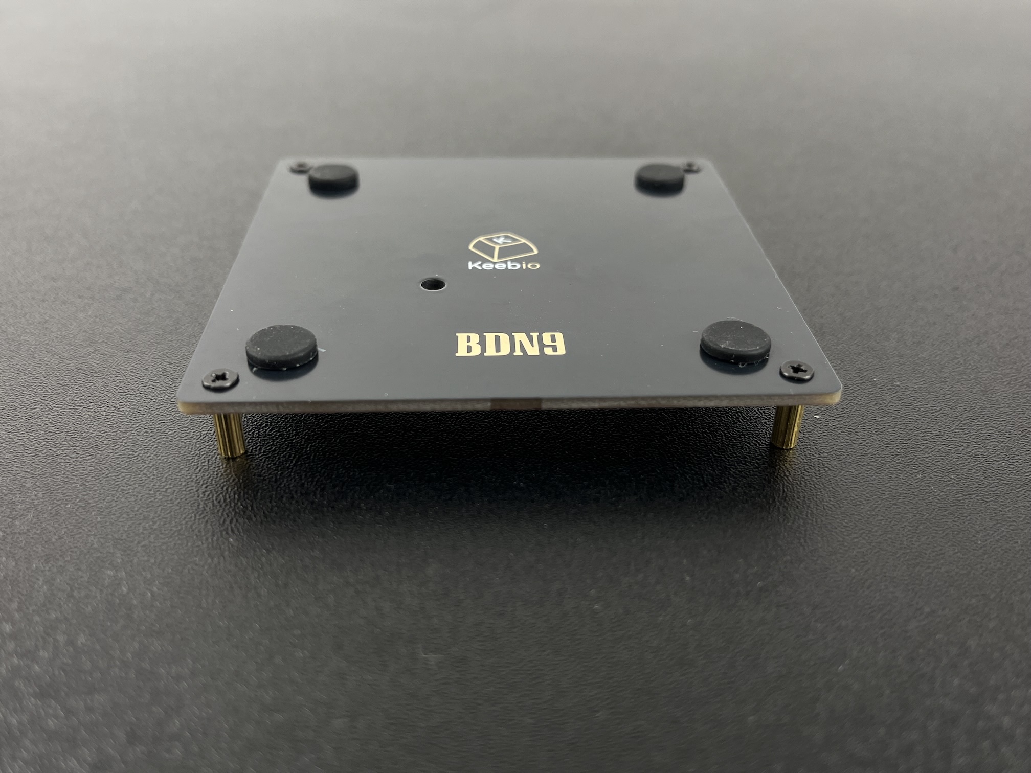 Standoffs screwed into bottom plate corners