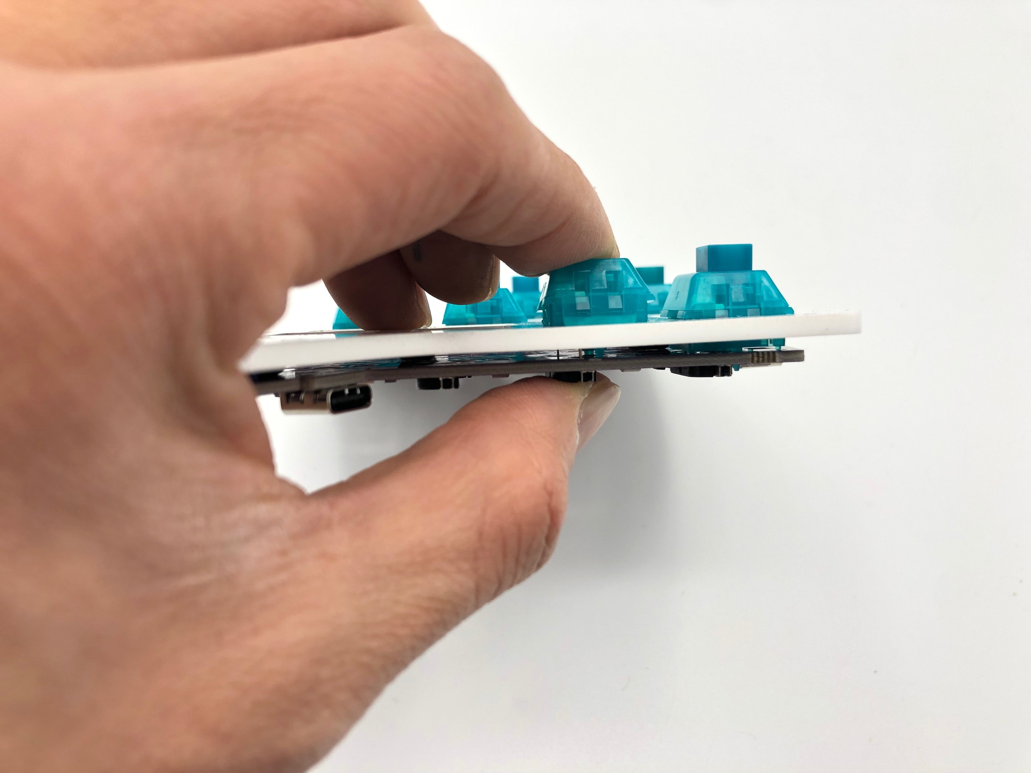 Hand Pressing Switches into PCB