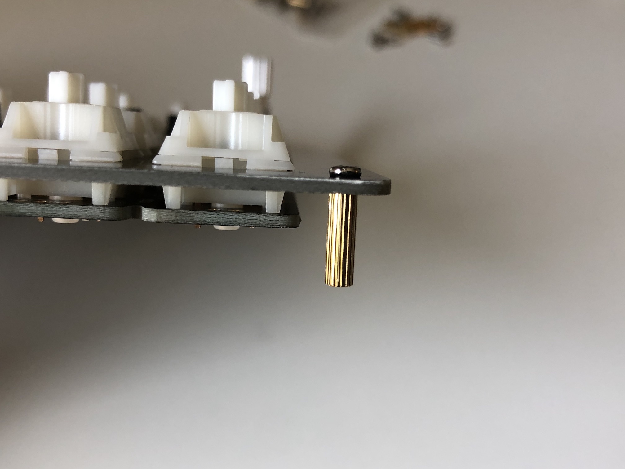 Standoff attached to switch plate corner