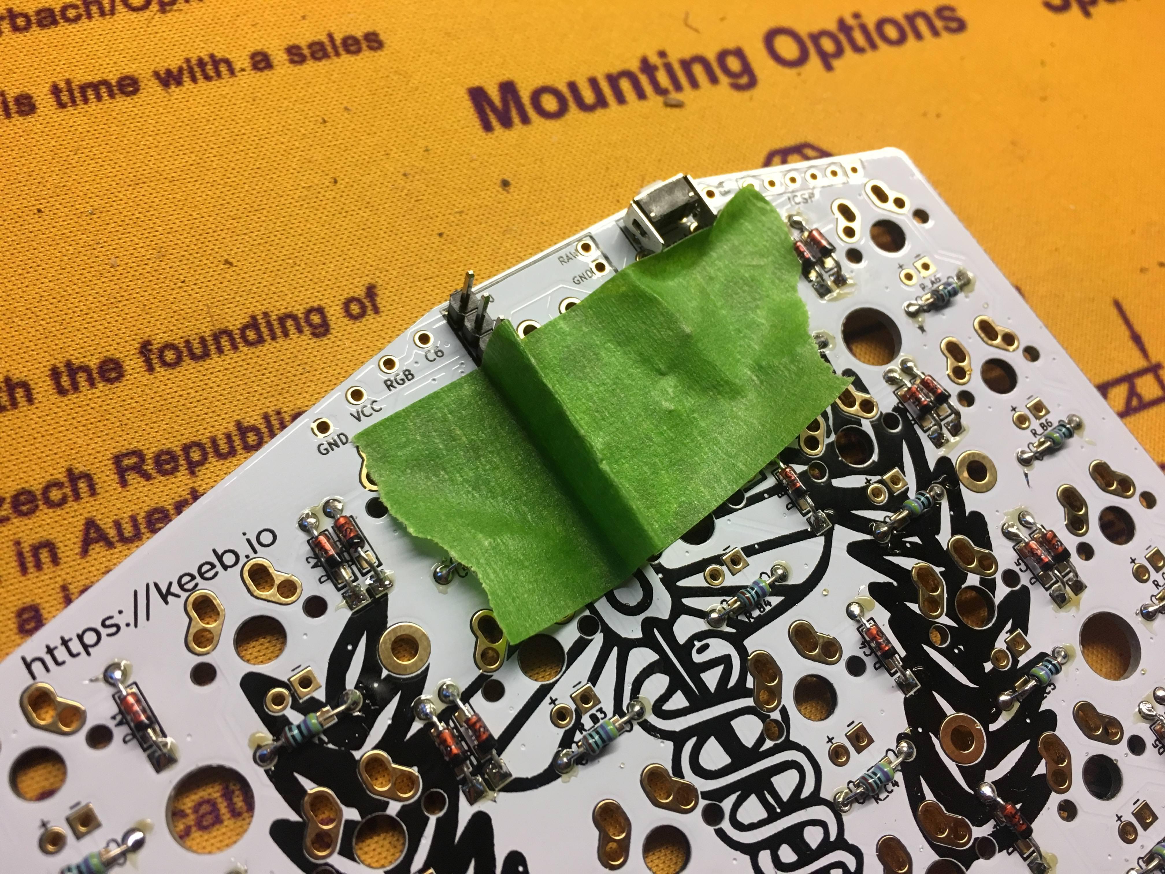 Tape Holding Header Pins in Place