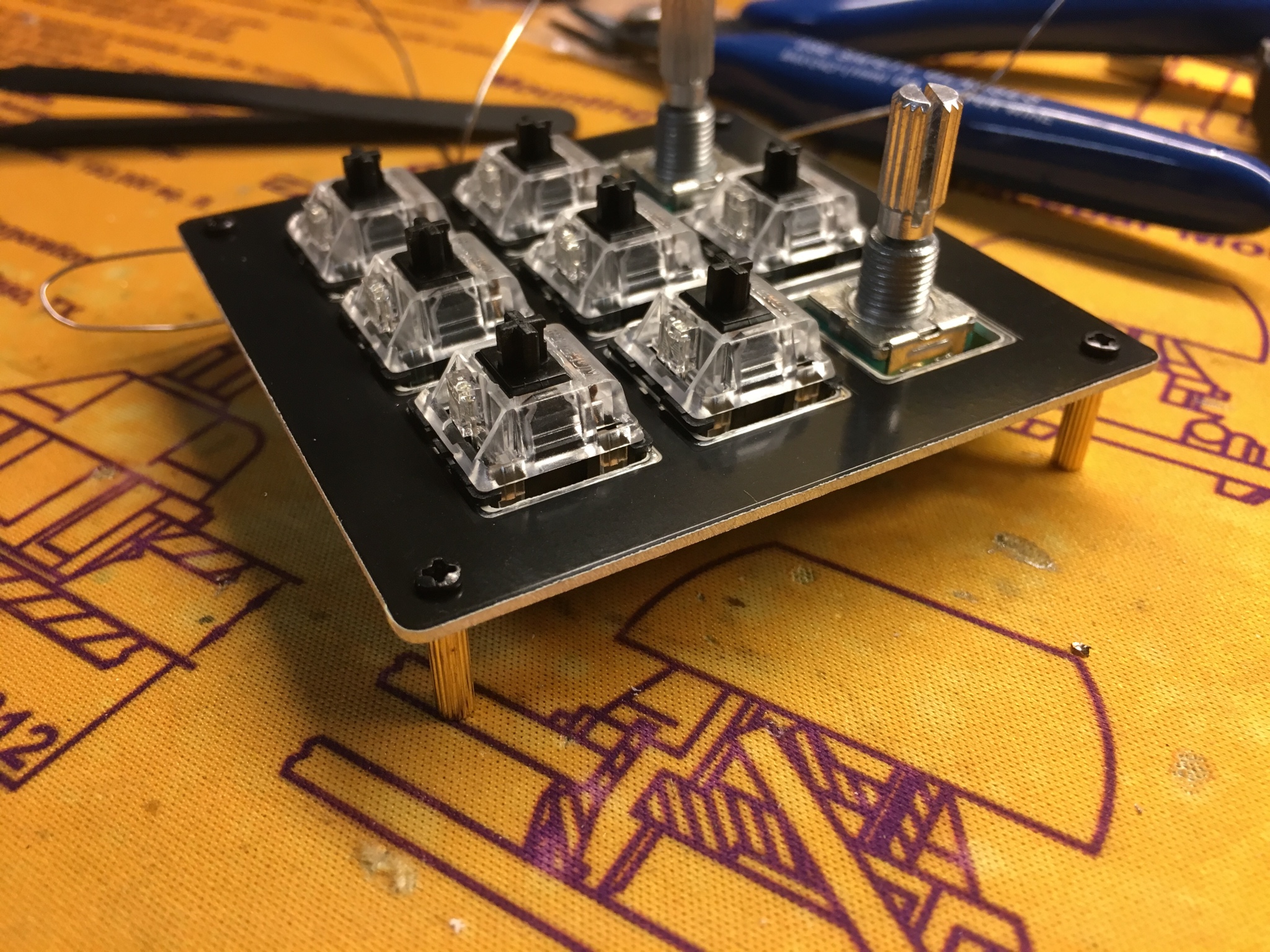 Standoffs screwed into switch plate