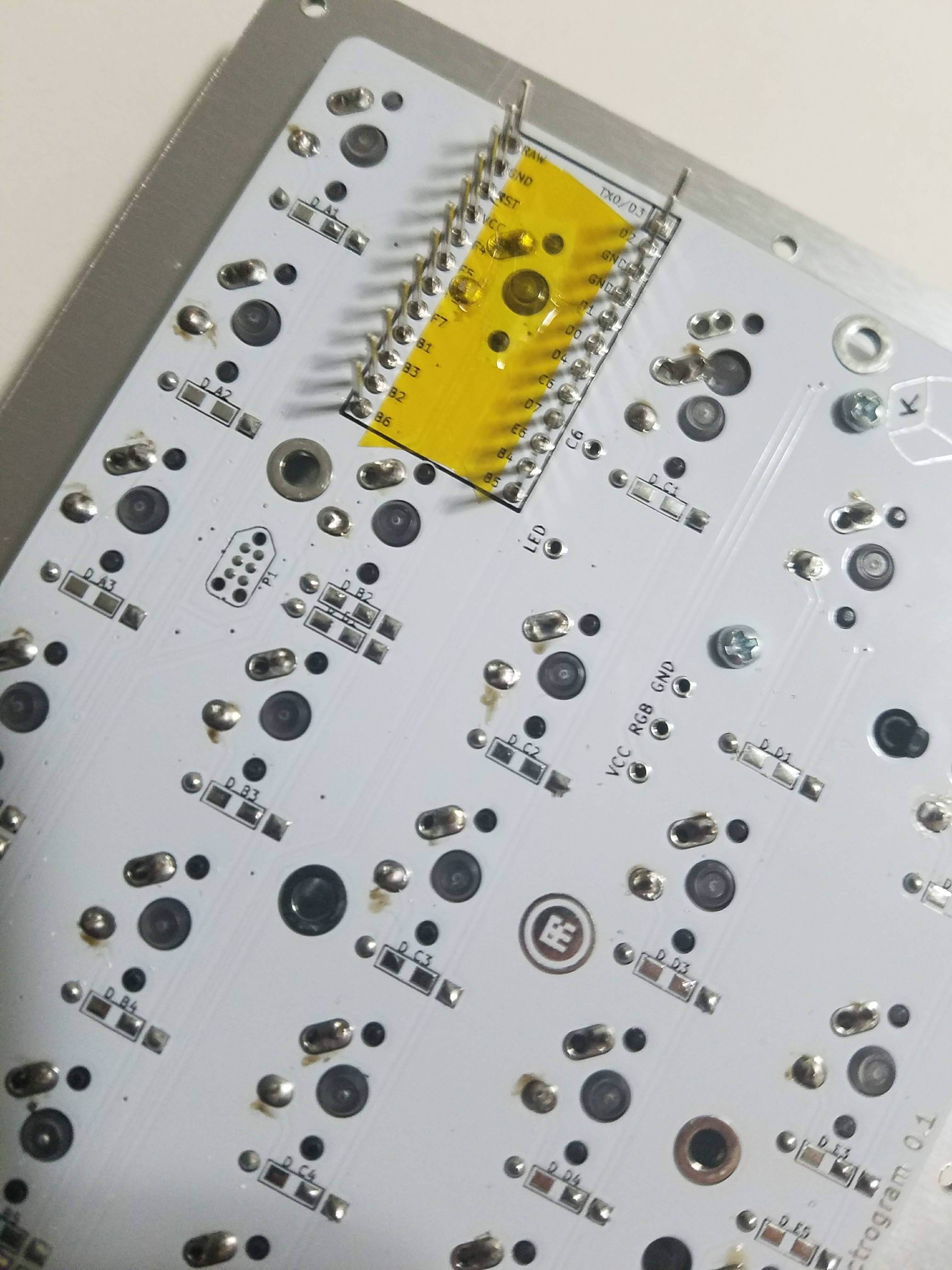 Switch pins clipped with Kapton tape applied