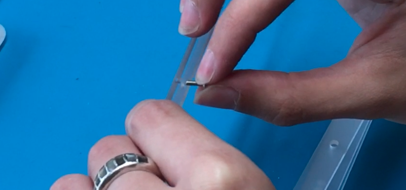Peeling protective film off acrylic foot piece